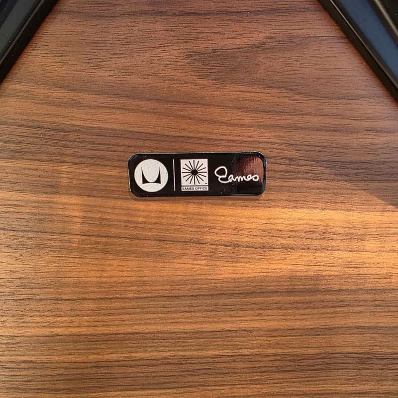 View of label black and walnut Eames Lounge Chair and ottoman