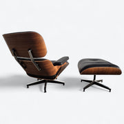 Angled rear right side view of black and walnut Eames Lounge Chair and Ottoman