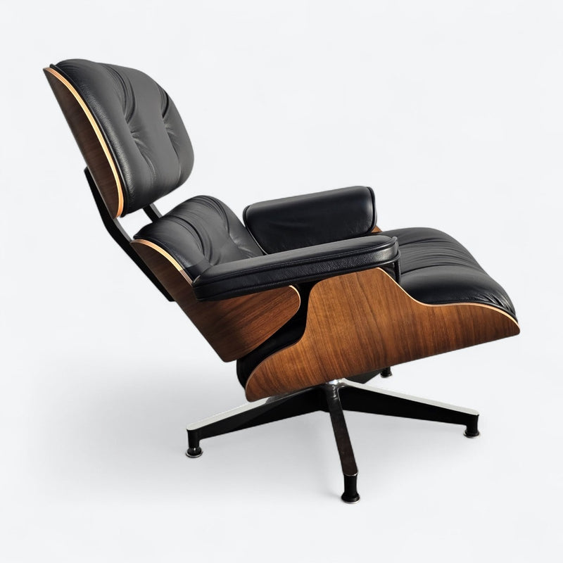 Right side view of black and walnut Eames Lounge Chair