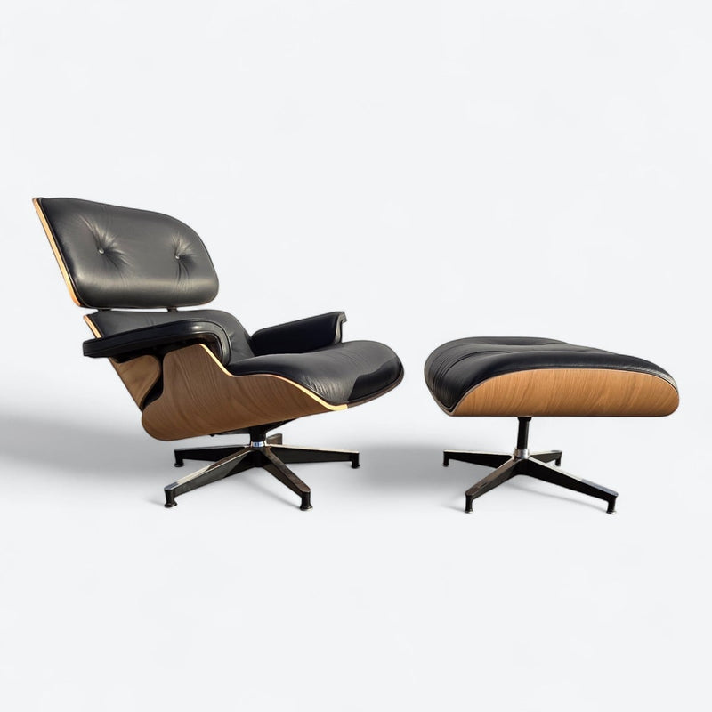 Right side angled view of black and oak tall Eames Lounge Chair and Ottoman
