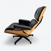 Left side view of black and oak tall Eames Lounge Chair