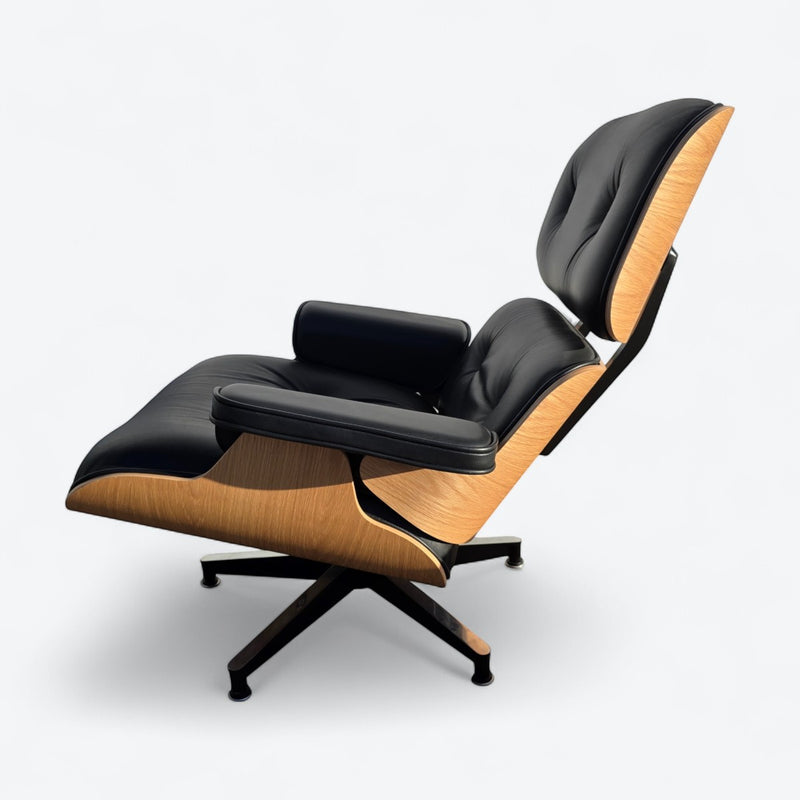 Left side view of black and oak tall Eames Lounge Chair