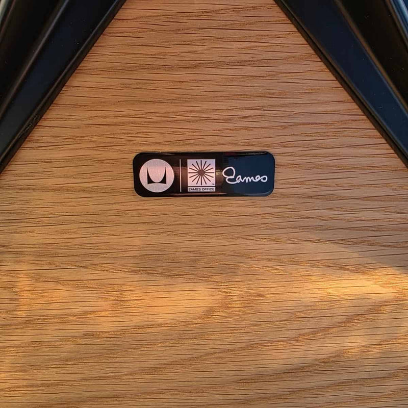 View of label on black and oak tall Eames Lounge Chair