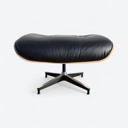Front view of black and oak tall Eames Lounge Chair Ottoman
