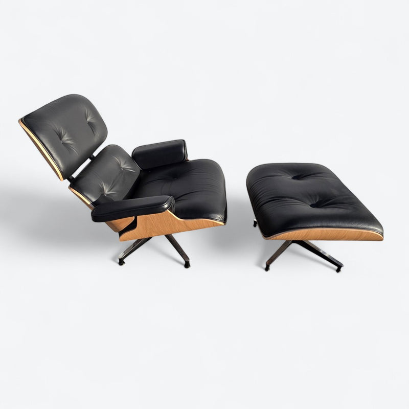 Top down right side view of black and oak tall Eames Lounge Chair and Ottoman