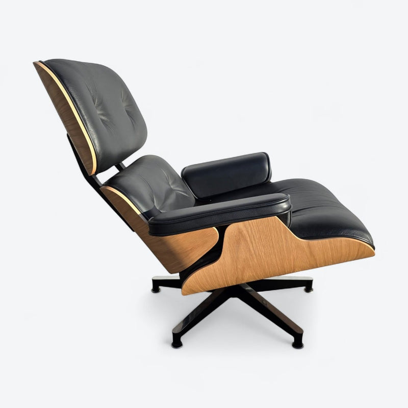 Right side view of black and oak tall Eames Lounge Chair