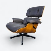 Left side front angled view of brown walnut Eames Lounge Chair