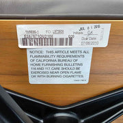 View of label on brown walnut Eames Lounge Chair and Ottoman