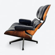 Left side view of black and rosewood Eames lounge chair