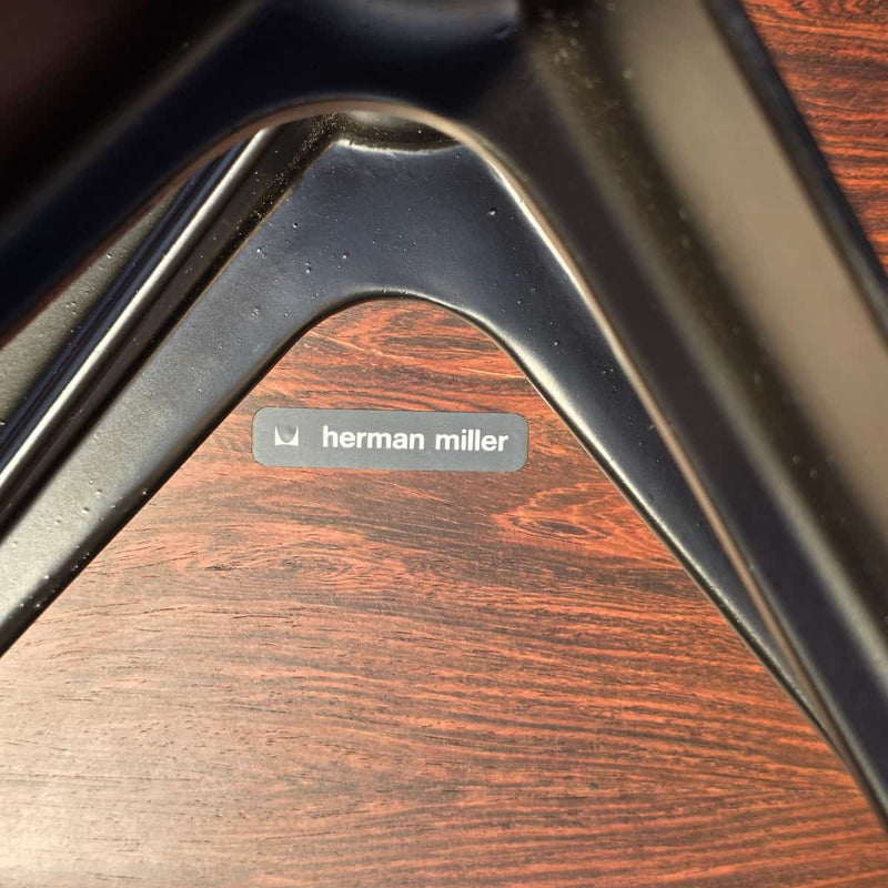 View of label on black and rosewood Eames lounge chair