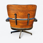 Rear view of black and rosewood Eames lounge chair