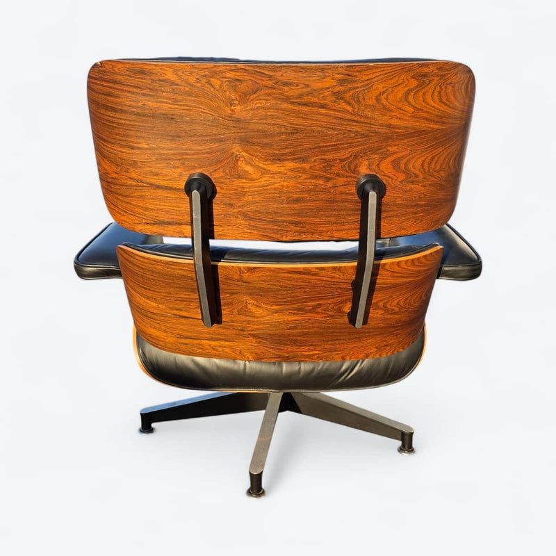 Rear view of black and rosewood Eames lounge chair