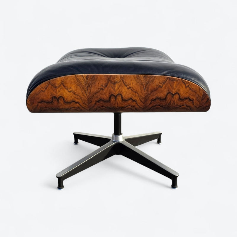 Right side view of black and rosewood Eames lounge chair ottoman