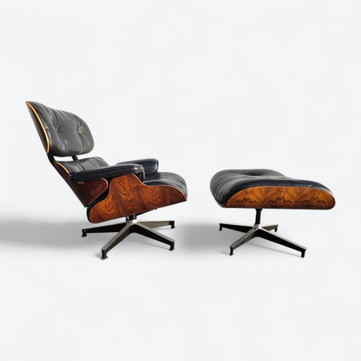 Right side view of black and rosewood Eames lounge chair and ottoman