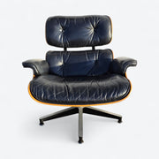 Front view of black and rosewood Eames lounge chair