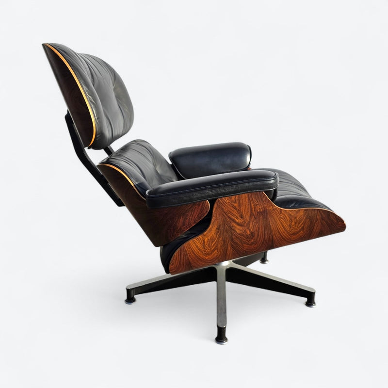 Right side view of black and rosewood Eames lounge chair