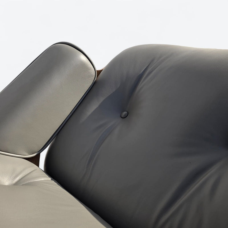 Close up view of seat cushion on grey and oak Eames Lounge Chair