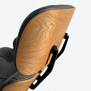 Close up side view of grey and oak Eames Lounge Chair