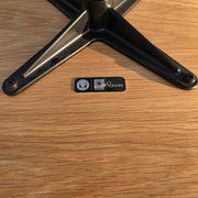 View of label on grey and oak Eames Lounge Chair and Ottoman