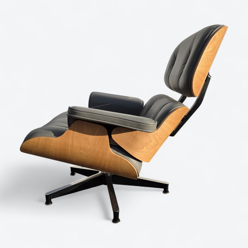 Left side view of grey and oak Eames Lounge Chair