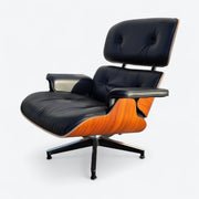 Front left angled view of black and santos tall Eames Lounge Chair