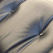 Close up view of leather on black and santos tall Eames Lounge Chair