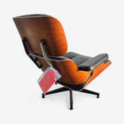 Rear right angled view of black and santos tall Eames Lounge Chair