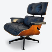 Front left view of black and walnut Eames Lounge Chair