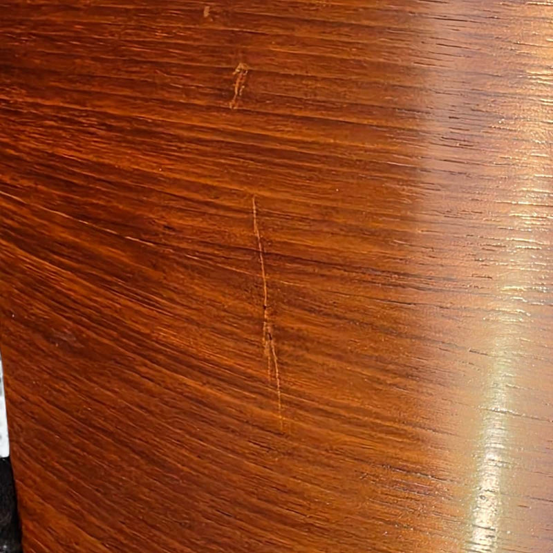 Close up view of wood on black and walnut Eames Lounge Chair