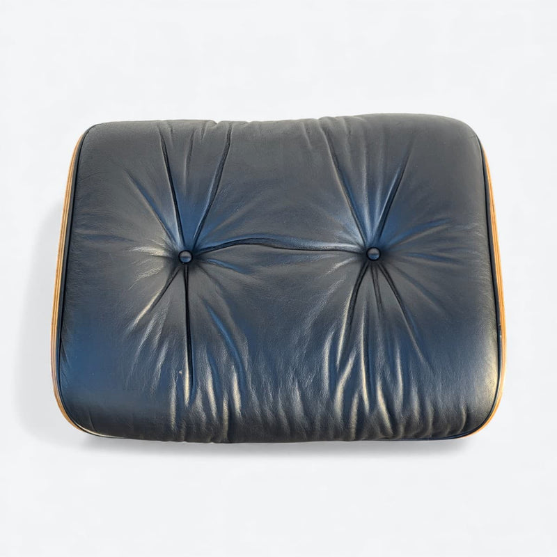 Top down view of black and walnut Eames Lounge Chair Ottoman