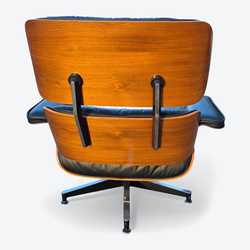 Rear view of black and walnut Eames Lounge Chair