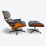 Right side view of black and walnut Eames Lounge Chair and Ottoman
