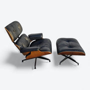Top down right side view of black and walnut Eames Lounge Chair and Ottoman