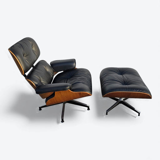 Top down right side view of black and walnut Eames Lounge Chair and Ottoman