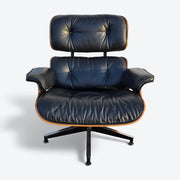 Front view of black and walnut Eames Lounge Chair