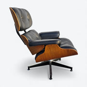 Right side view of black and walnut Eames Lounge Chair