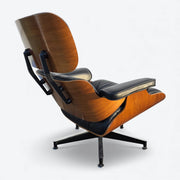 Rear right side view of black and walnut Eames Lounge Chair