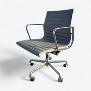 Front left angled view of light grey Eames EA335 Desk Chair