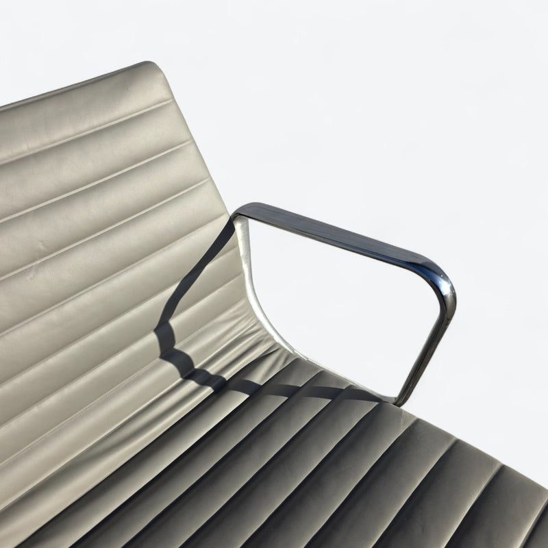 Artistic partial top down view of light grey Eames EA335 Desk Chair