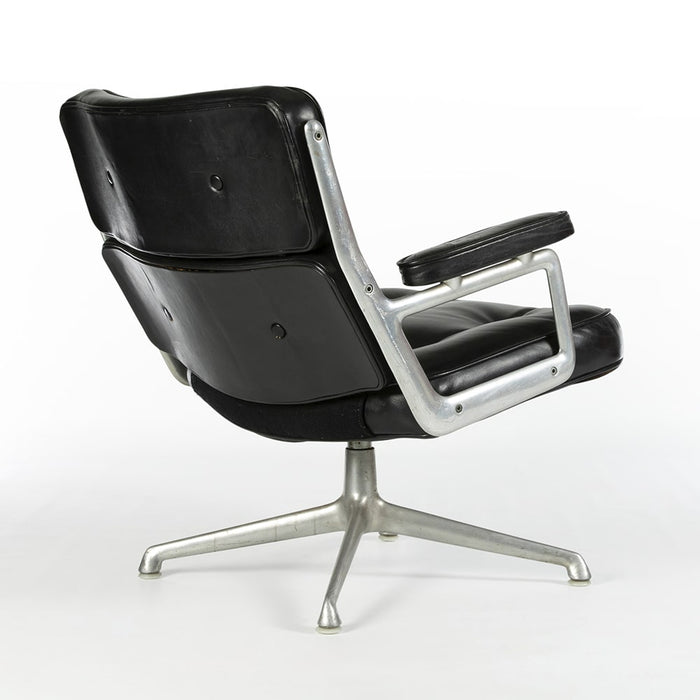 Rear angled view of Black 675 Eames Lobby Chair on white background