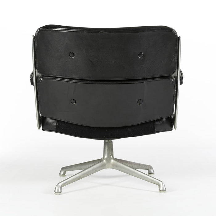 Rear view of Black 675 Eames Lobby Chair on white background