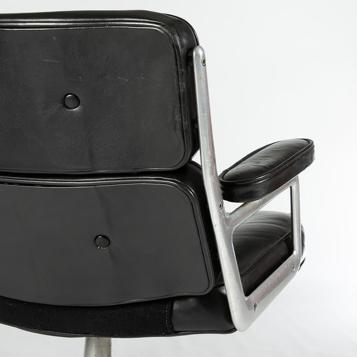 Close up rear view of Black 675 Eames Lobby Chair on white background