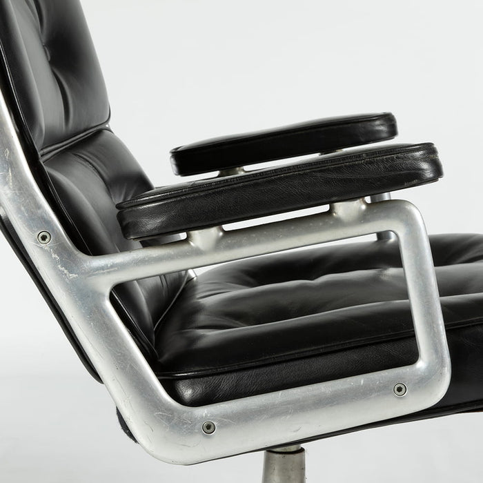 Close up right side view of Black 675 Eames Lobby Chair on white background