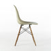 Right side view of grey yellow Eames Side Chair on a white background