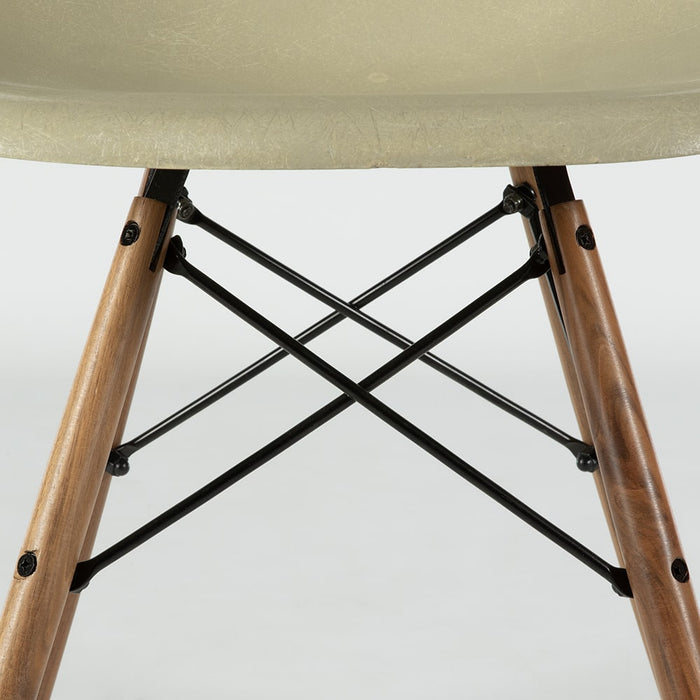 View of base on grey yellow Eames Side Chair on a white background