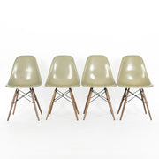 Front view of 4 Grey Yellow Eames Side Chairs on a white background