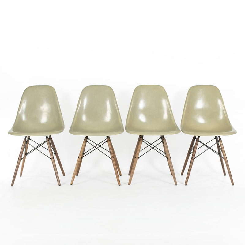 Front view of 4 Grey Yellow Eames Side Chairs on a white background