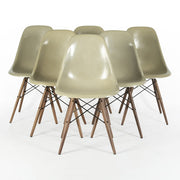Front view of set of 6 Grey Yellow Eames side chairs on a white background