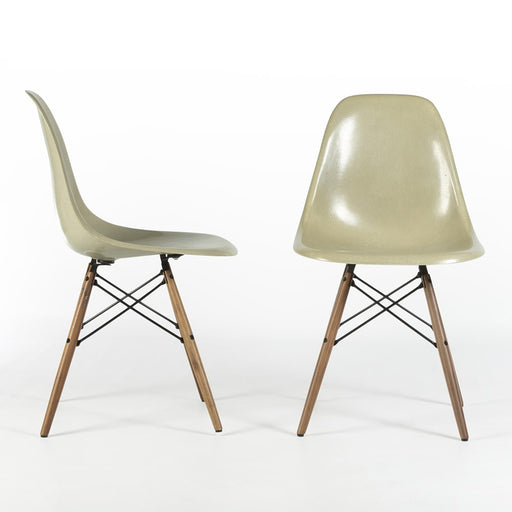 Front and right side view of grey yellow Eames Side Chairs on a white background