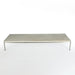 Top angled front view of white marble Kjaerholm PK63 coffee table